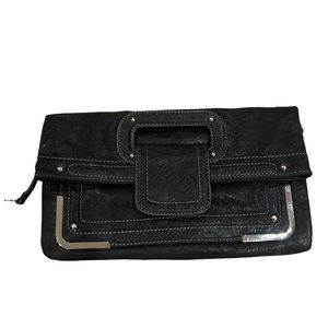 Nine W. clutch purse with adjustable Crossbody strap. Black with silver accents.